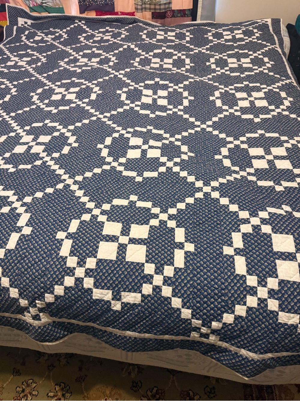handmade patchwork quilt features the traditional Burgoyne Surrounded pattern